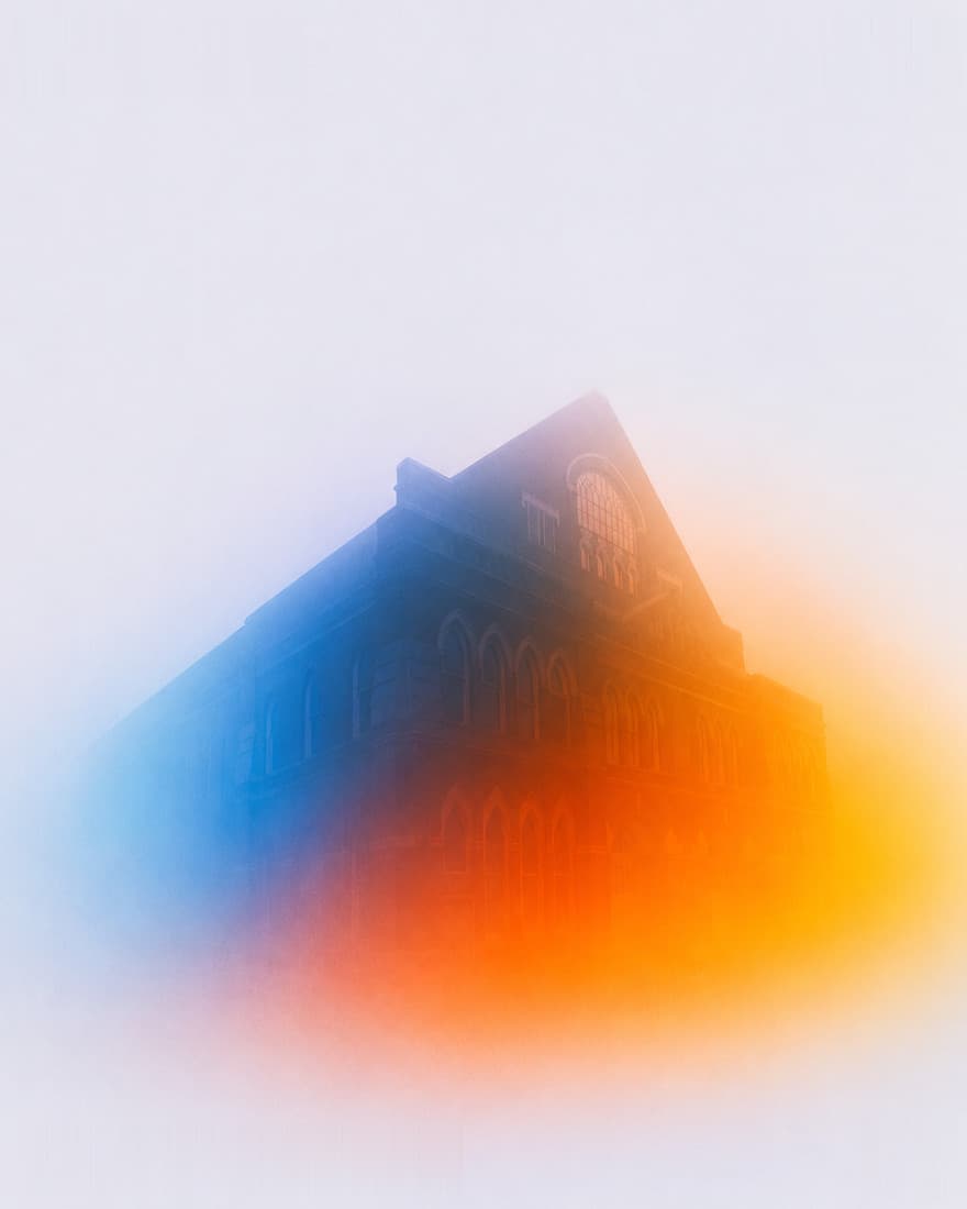 The Ryman Auditorium against a wash of colour